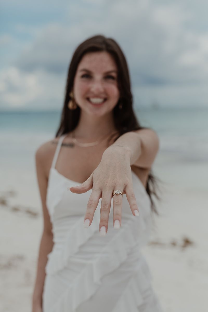 Engagement ring close-up during a beach photoshoot at Playa Xpu Ha.