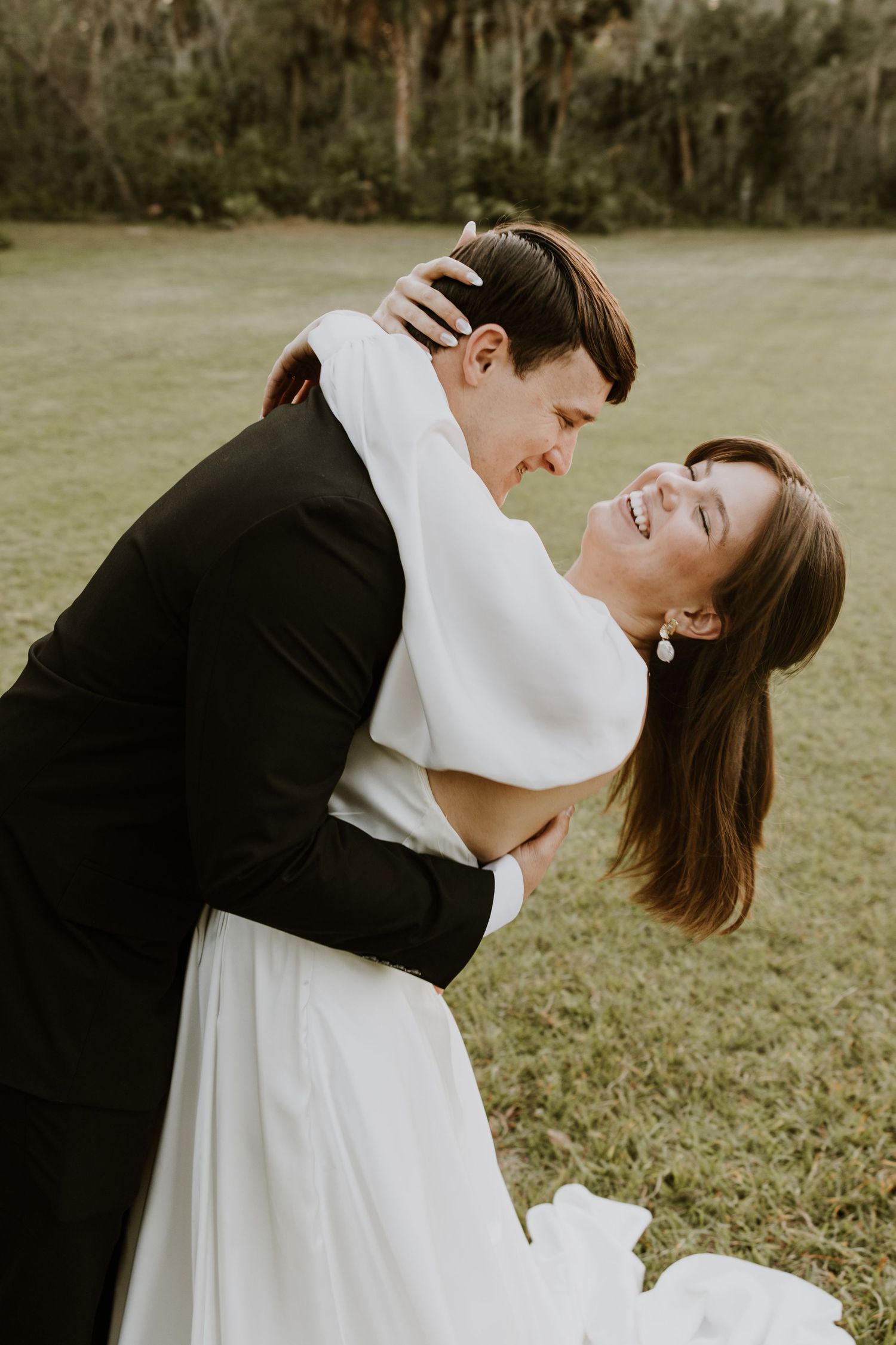 Bride and groom photos from wedding in Fort Meade, Florida at Camp Wilderness captured by Lindsay McDow Photography. Outdoor wedding