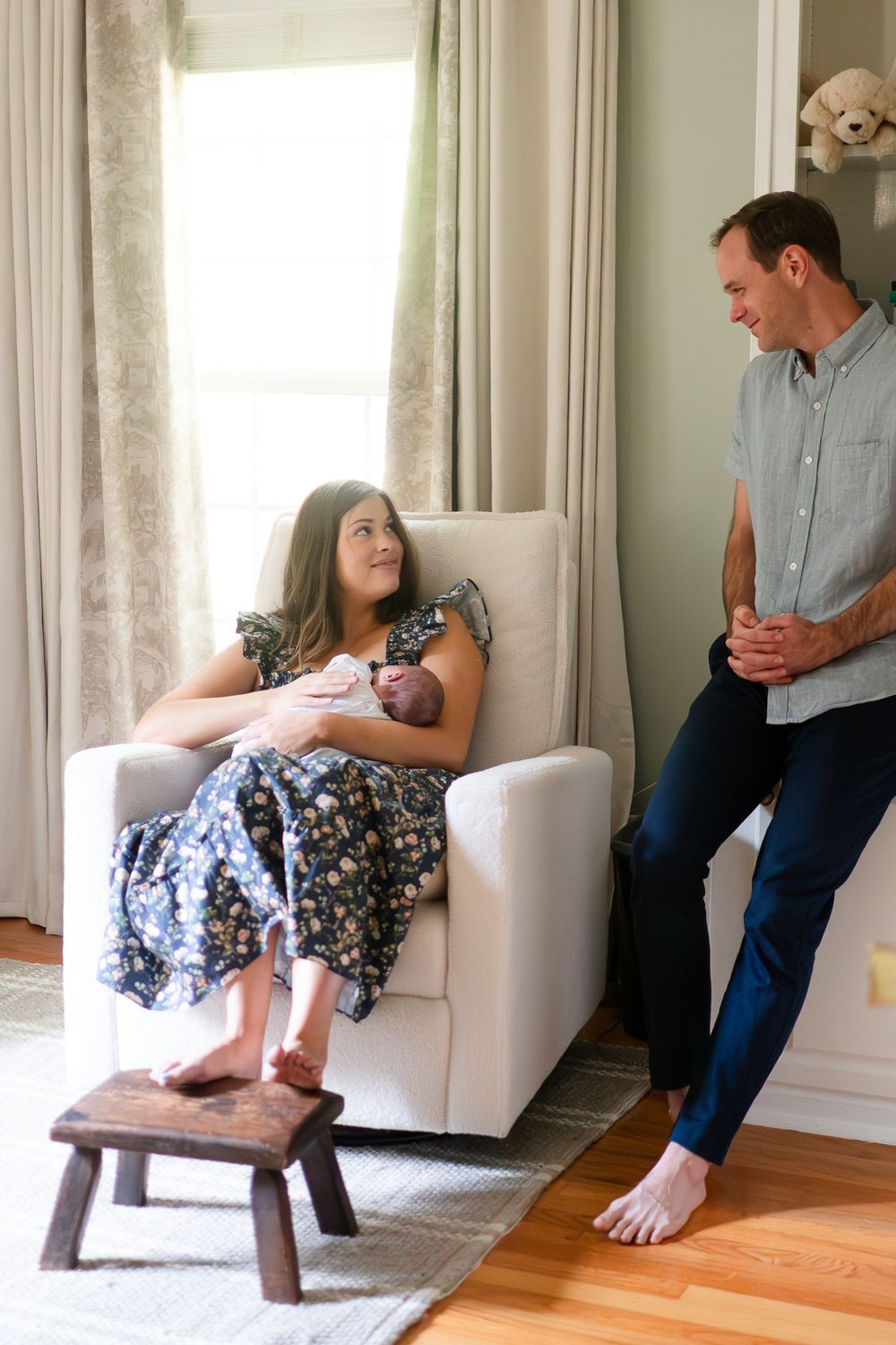 Sequence of five photos showing a birth photography session in a room with white curtains and hardwood floors.