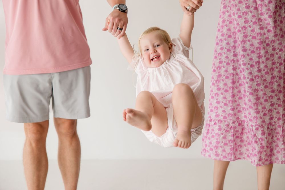 Group photo sequence featuring family members wearing pink and gray coordinated outfits against a white background.