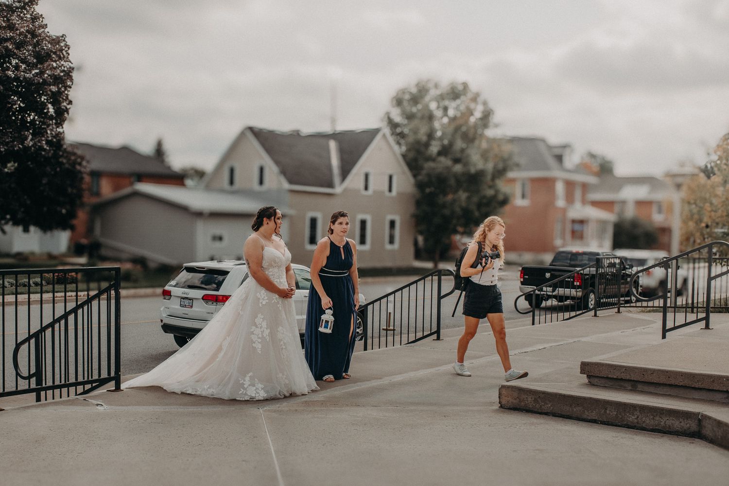 Photographer and bride and groom walking. Mexico wedding photography.
