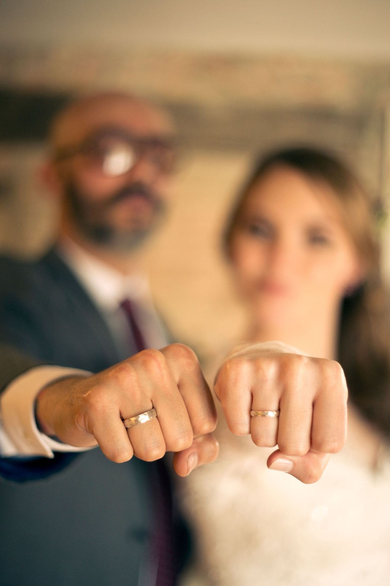 A couple poses for a portrait during their wedding