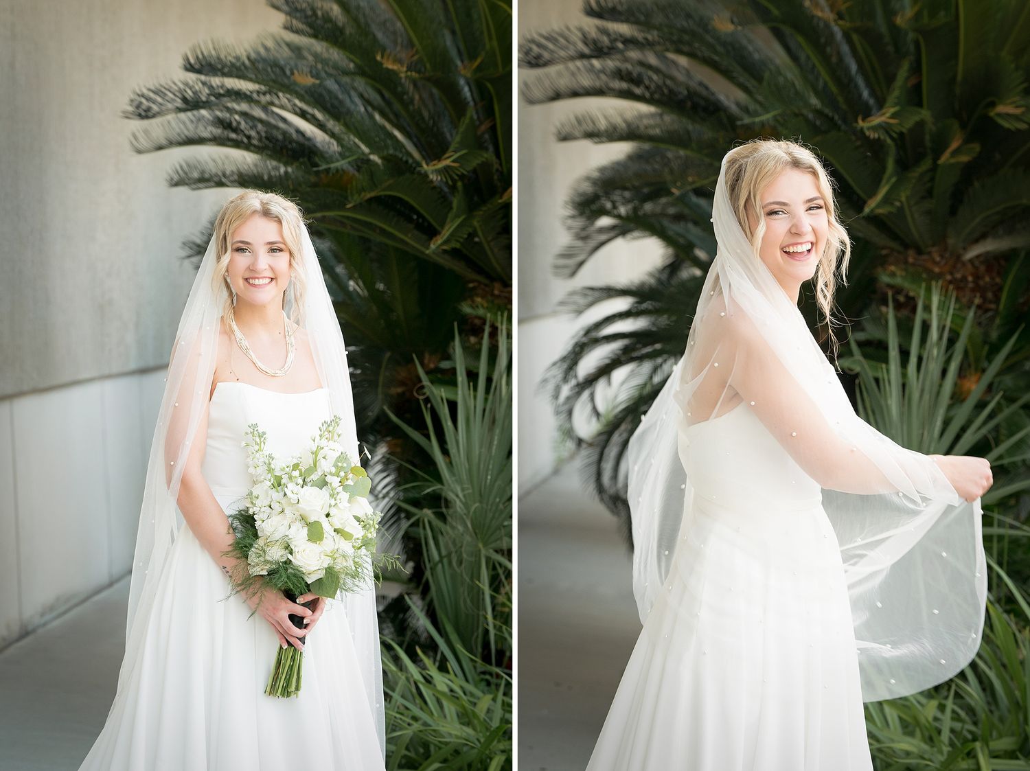 Bride in flowing white gown with veil poses with bouquet against tropical foliage.