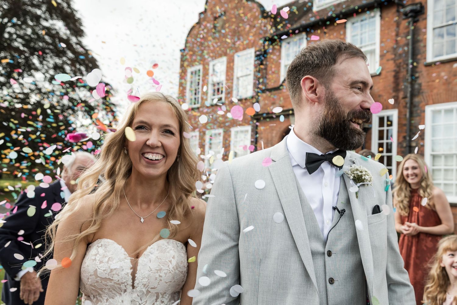 Bride & Groom at Kelham House, natural candid confetti photo.