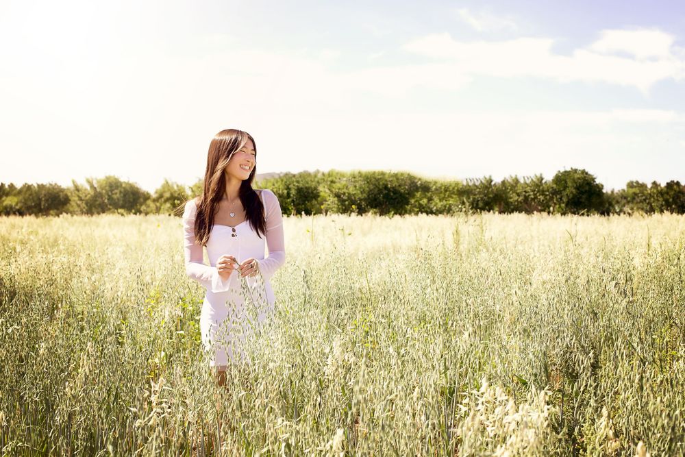 Ethereal portraits captured in a golden meadow during sunset hours.