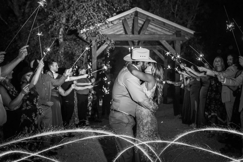 Sparkler exit at Whispering Oaks modern barn wedding with rustic charm and elegant details