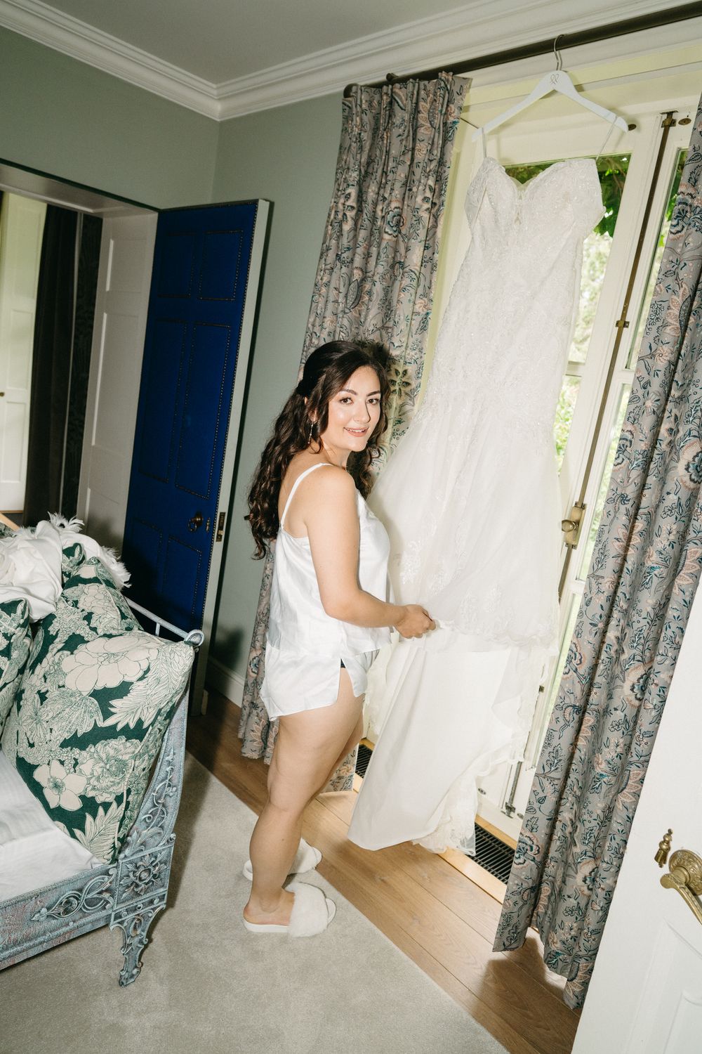 White curtains move in sequence showing natural breeze movement through interior room window panels in vintage style.