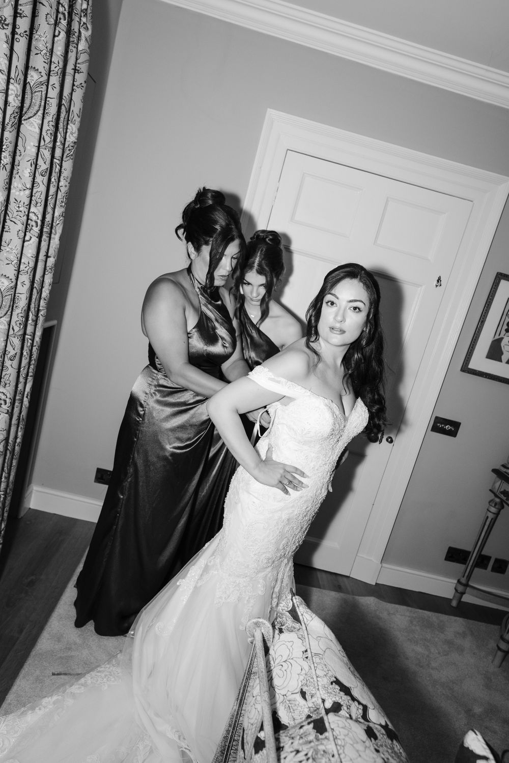 A series of candid moments show someone getting ready in a white lace wedding dress, with fluttering movements.