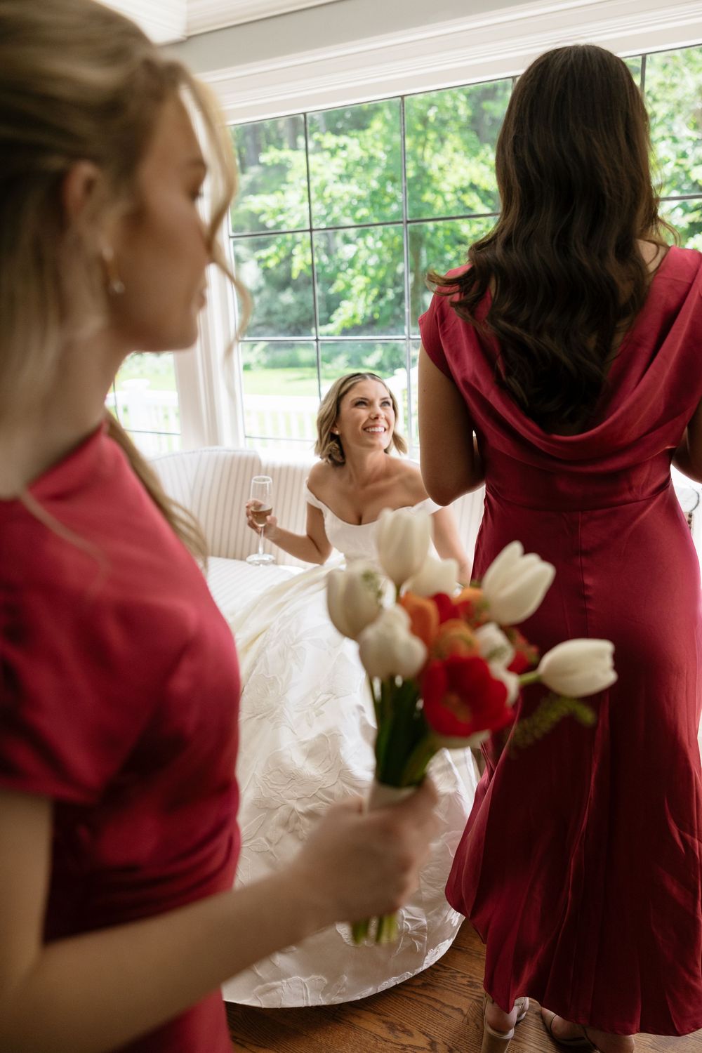 Series of candid wedding moments showing bride and bridesmaid interacting with white floral bouquets.