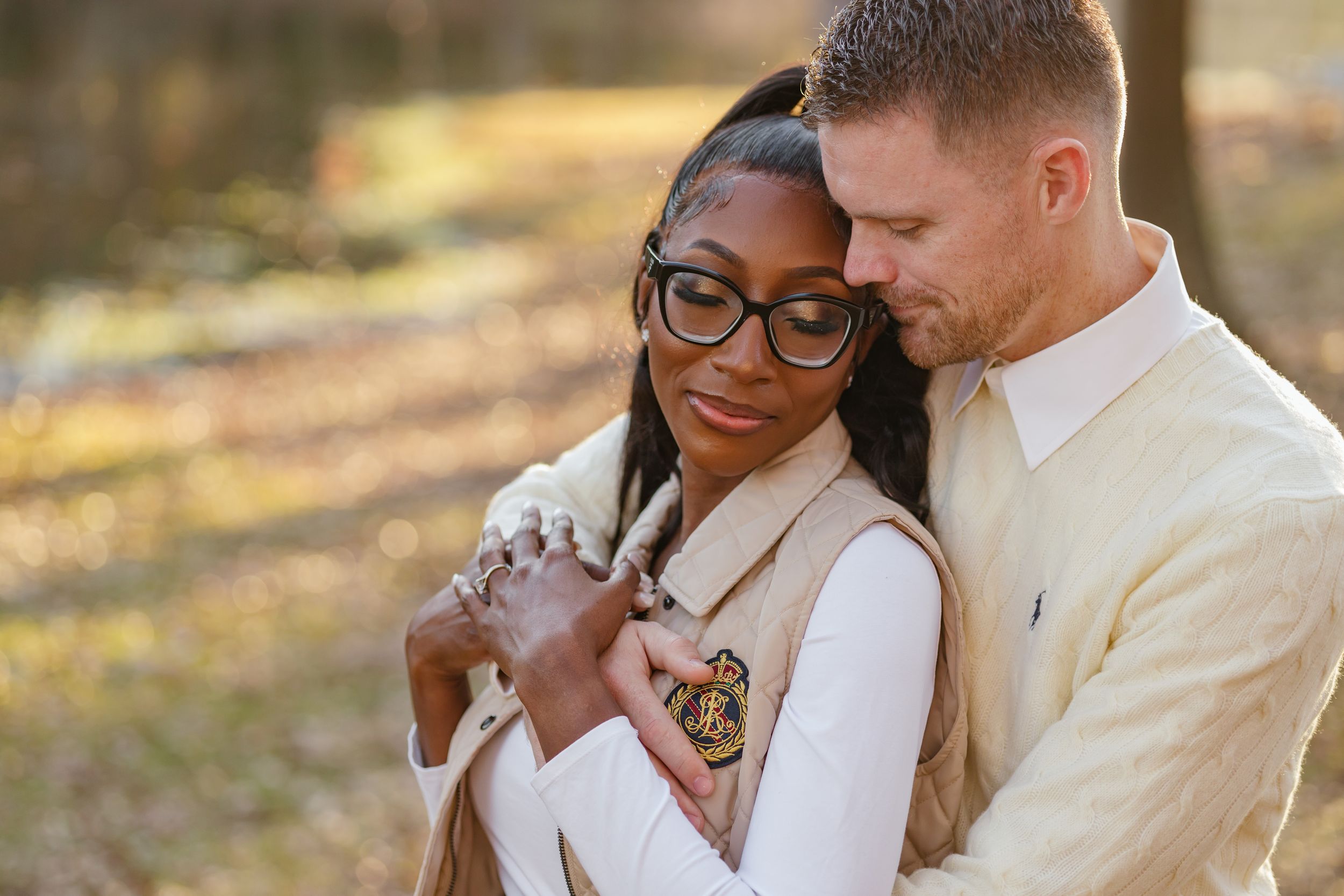 Romantic couple shares tender moments in outdoor setting with natural lighting and warm tones.
