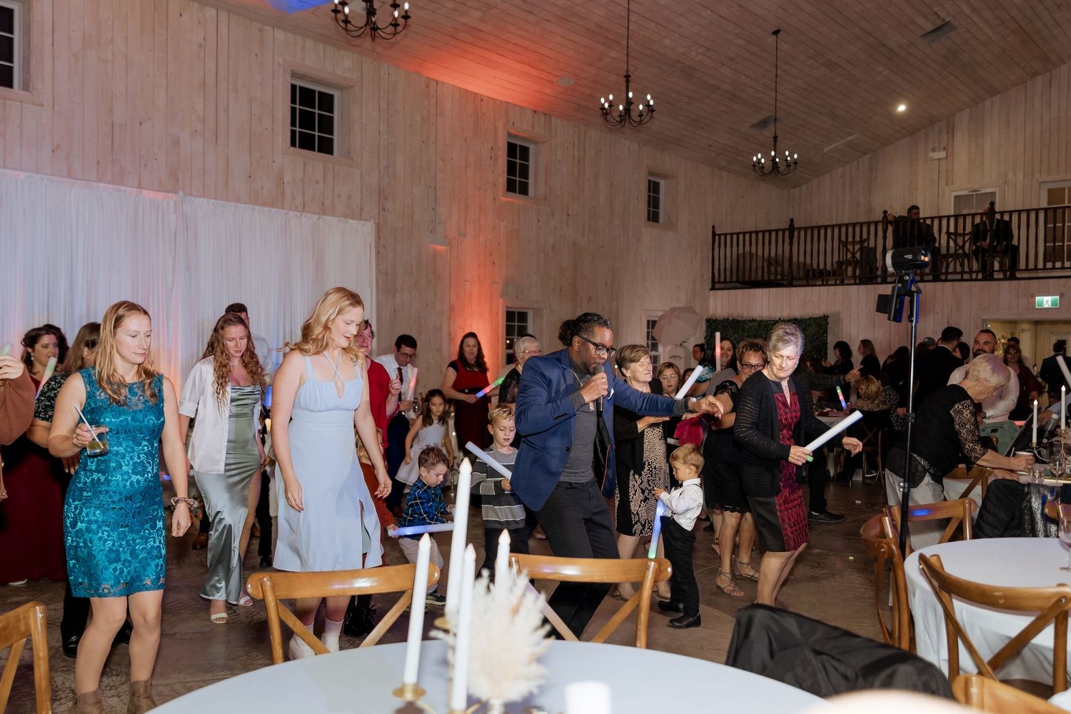 Felix Belliveau playing live music at engagement party at Crooked River distillery surprise wedding photography in New Brunswick