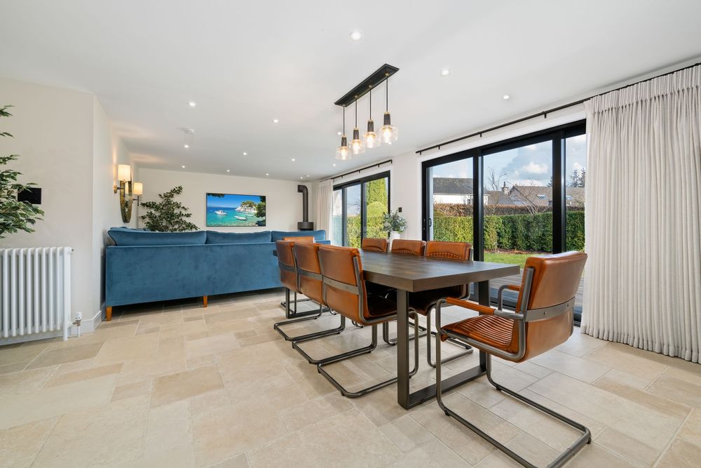 Spacious modern interior with open floor plan and large windows.