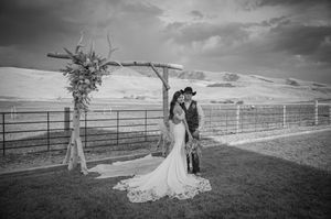 Black and white panoramic wedding photos captured in a scenic countryside setting.