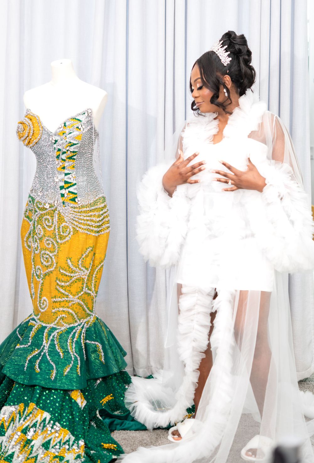 Elegant wedding dress featuring a gold and emerald green embroidered design with intricate beading details.
