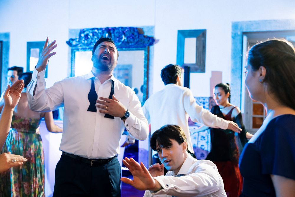 Destination wedding party at Quinta do Torneiro with couple dancing in the middle of the crowd