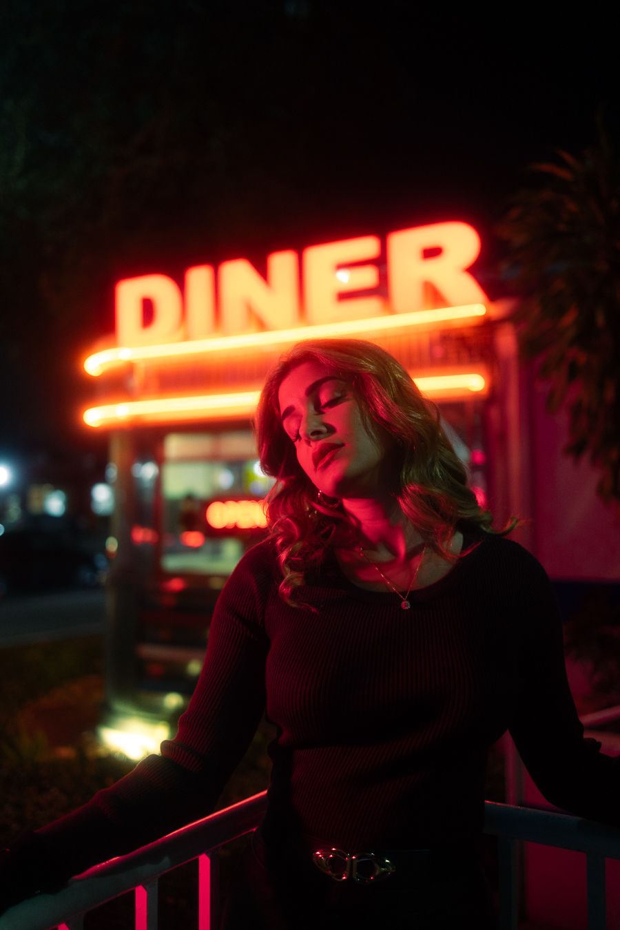 Cinematic diner shoot with bold neon, Rolling Stone magazine vibe perfect for indie album cover, South Florida Mannyportraits photo.