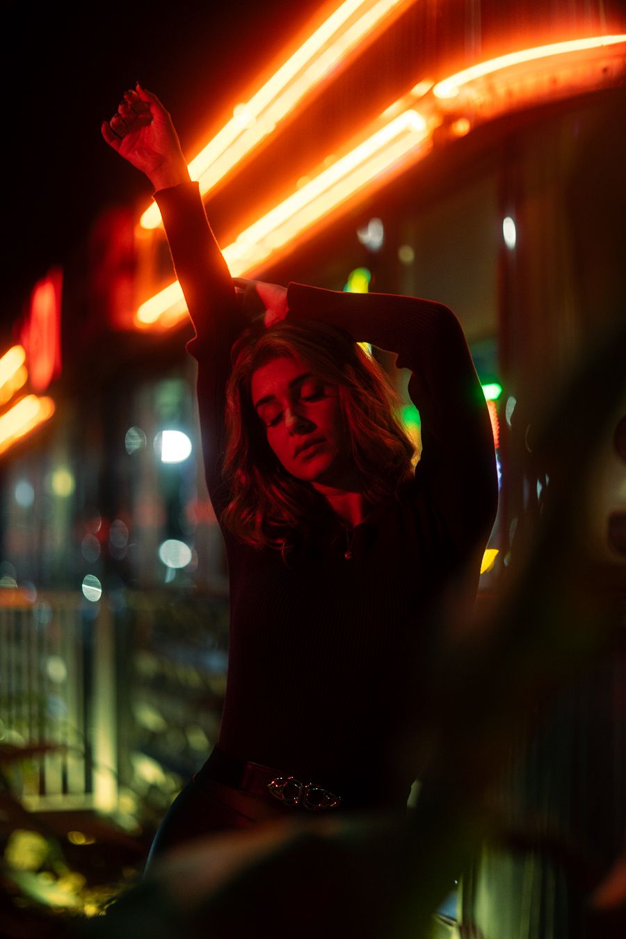 Moody diner portrait with neon red glow, cinematic editorial style for Spotify mixtape or EP cover, shot in Miami by Mannyportraits.