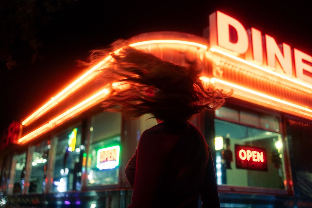 Moody Miami diner shot, cinematic fashion photography with Spotify single cover aesthetic by Mannyportraits editorial style.