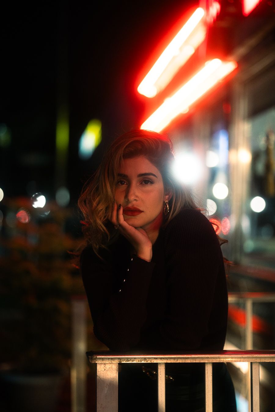 Cinematic portrait outside neon Miami diner, moody editorial lighting like a Rolling Stone cover, Mannyportraits fashion photography.