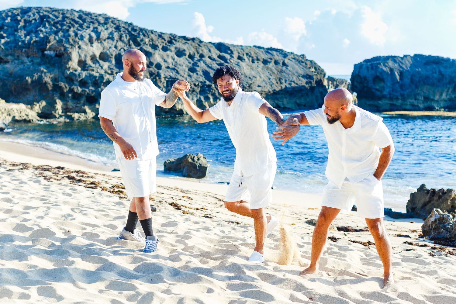 Family portrait on the beach. Three brothers. Playa Mar Chiquita, Puerto Rico.