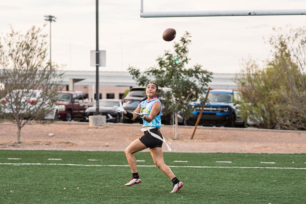 Flag Football Player catching a football