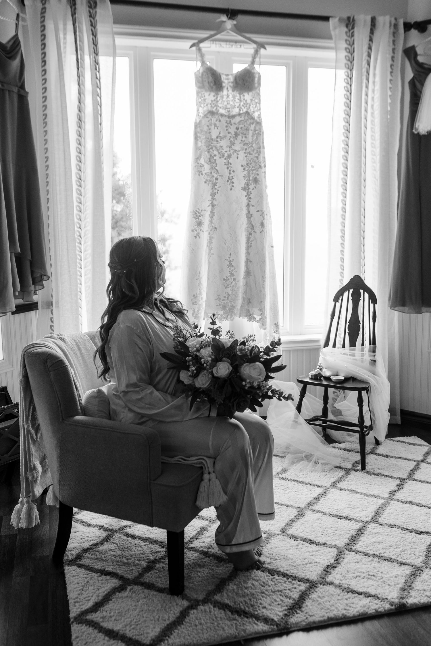 A sequence of black and white photos showing someone seated by bright windows holding flowers on a patterned carpet.