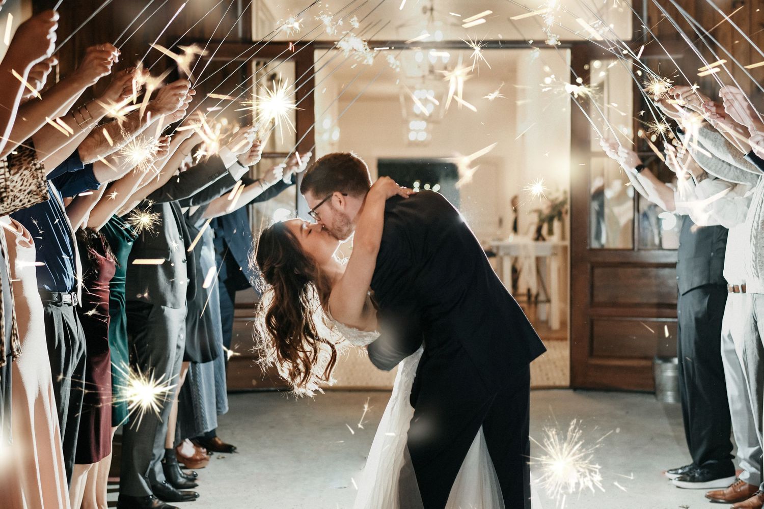 a dramatic photo of a sparkler exit at oak and ivy wedding venue