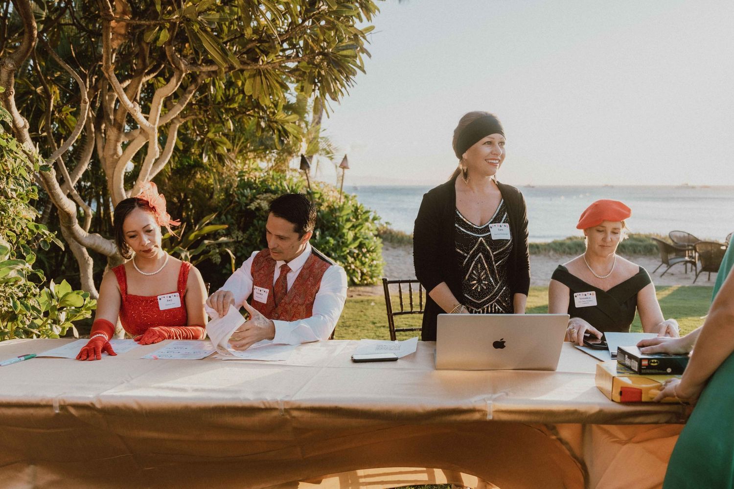 MWEA celebration at Sugar Beach guests signing in at a registration table during a tropical destination ceremony on Maui, Hawaii