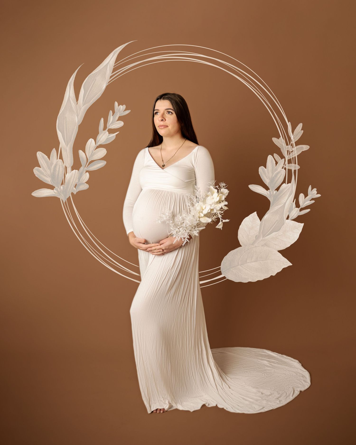 A figure in a flowing white maternity gown poses against a brown backdrop with decorative white floral and circle designs.