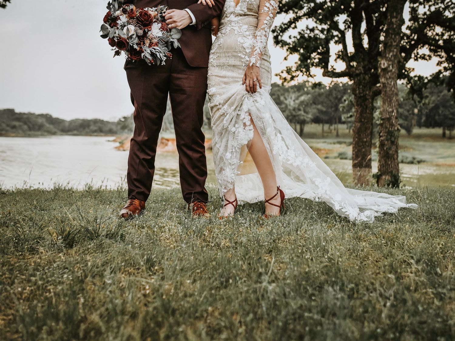 Bride and groom walking together outside Bentley Station wedding venue