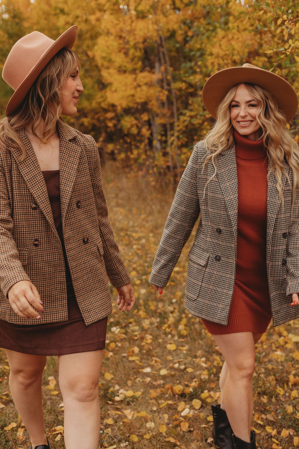 A person in a brown plaid blazer and burgundy dress poses against autumn foliage in a series of candid shots.