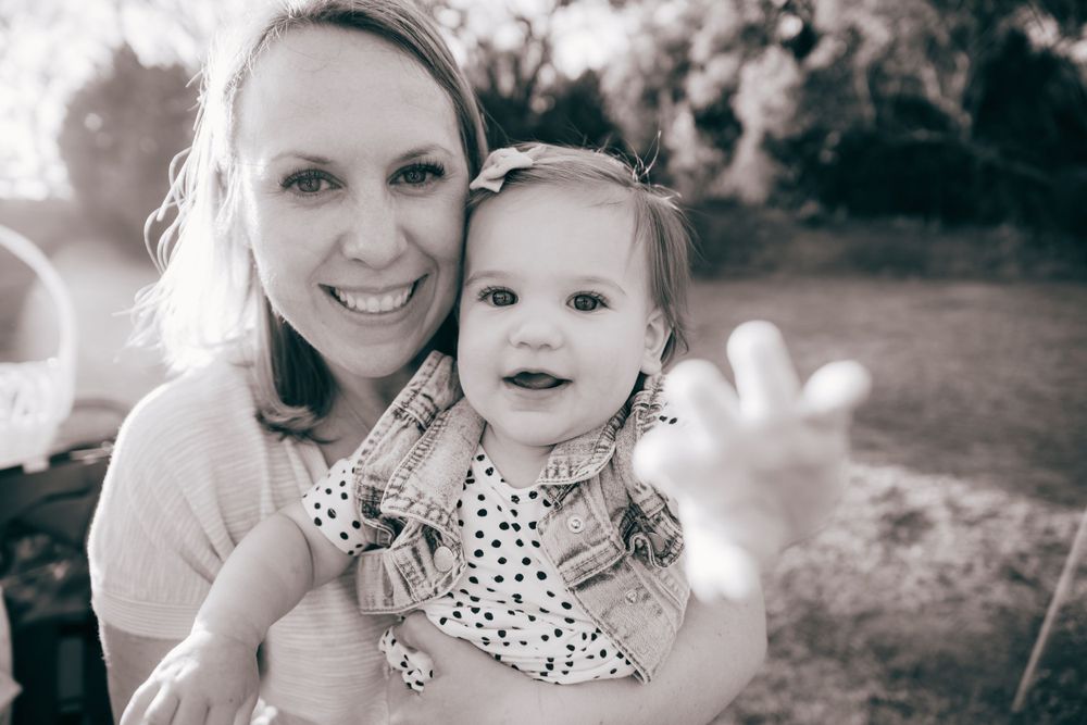A black and white portrait showing tender embraces and smiles.