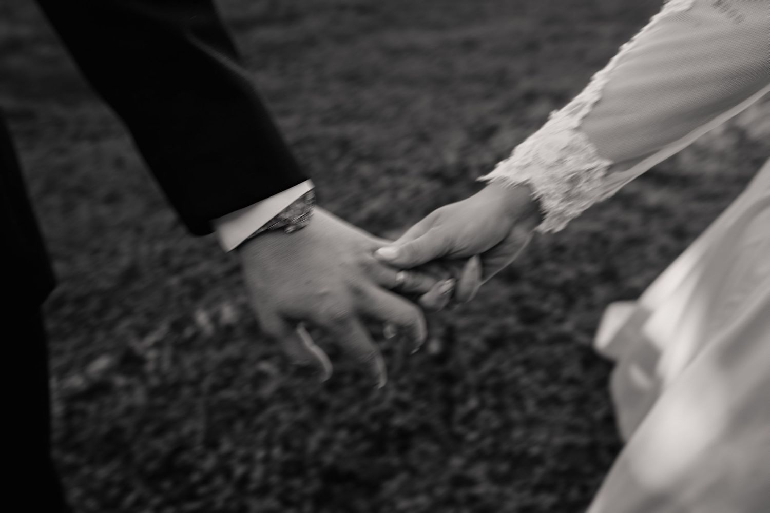 Close-up shots of hands touching in black and white photography.