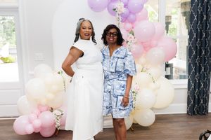 A festive gathering with pastel balloon arrangements and elegant decor.