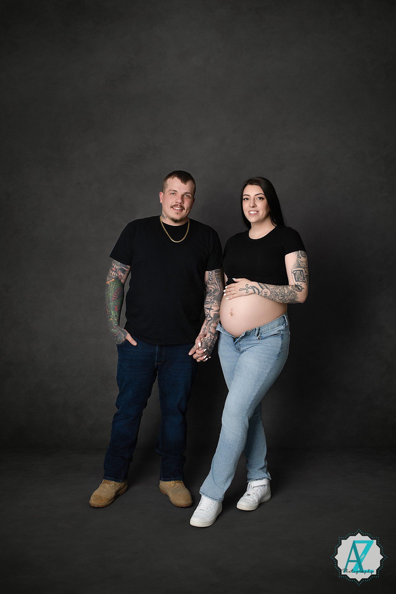 A maternity photo series showing a couple in casual attire against a dark backdrop, progressing from full body to cropped shots.