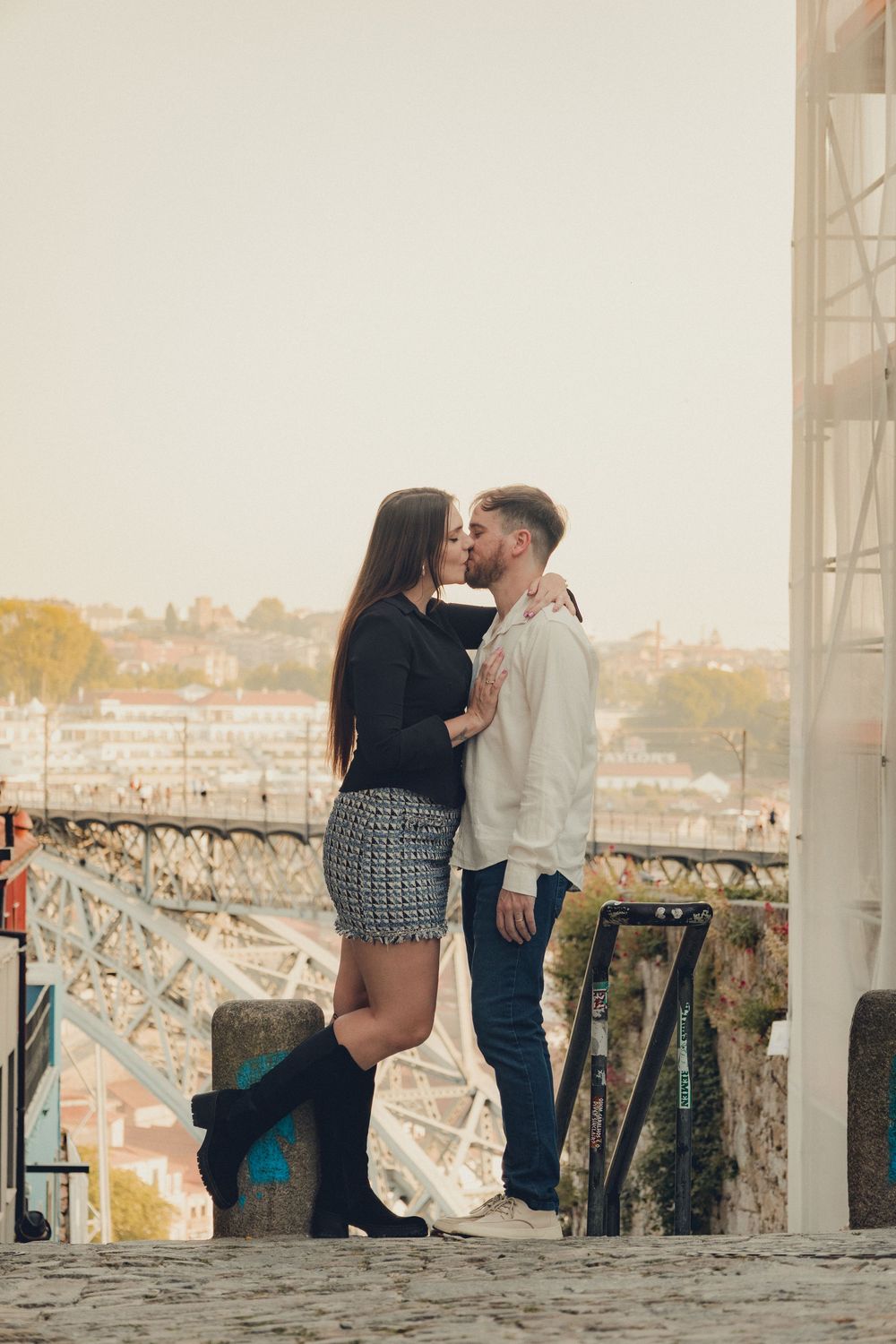 Romantic sunset moment by historic bridge and river.