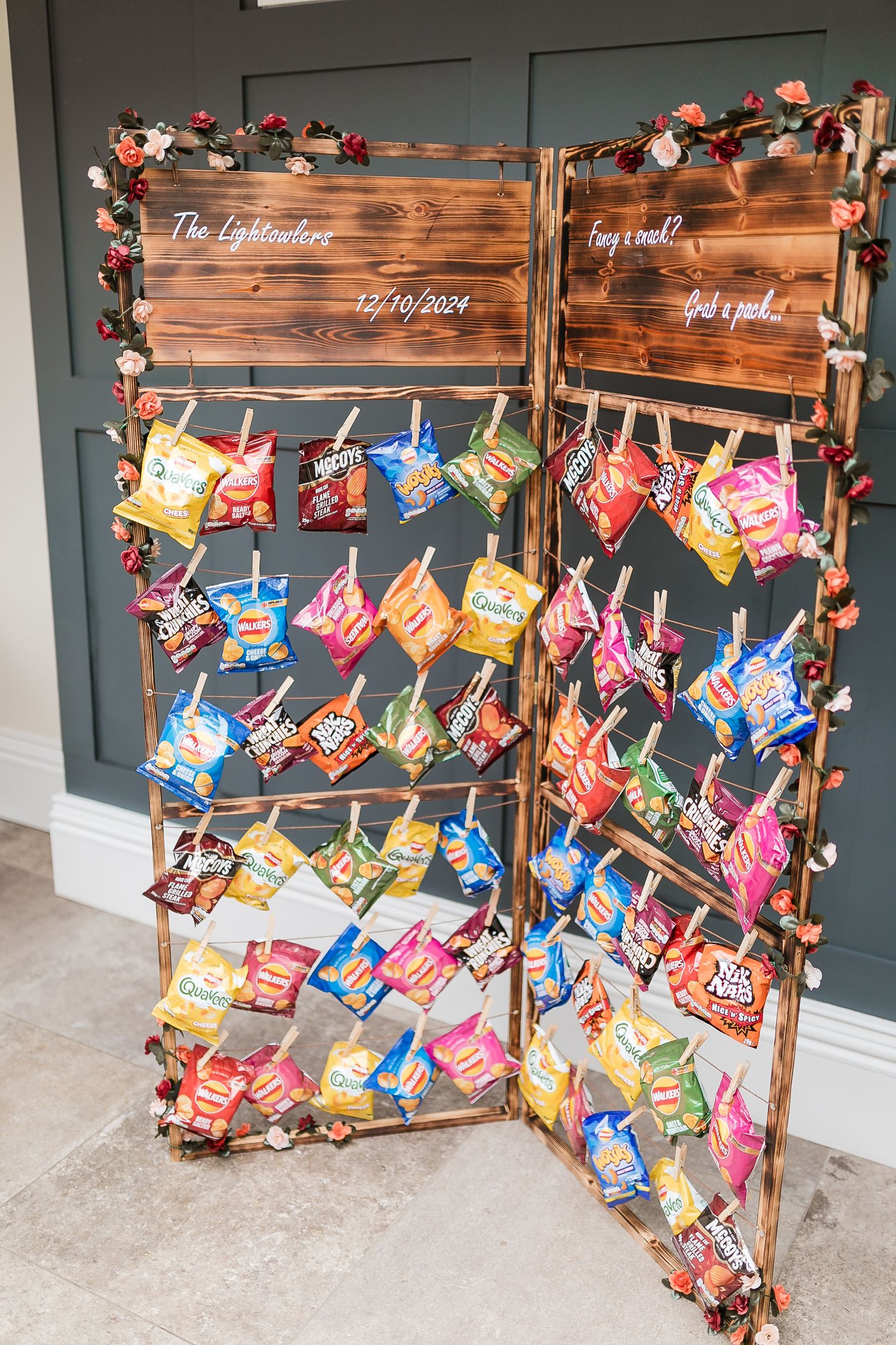 Creative snack display featuring hanging bags of chips on a rustic wooden board. Photographer. Hull. East Yorkshire. Photography