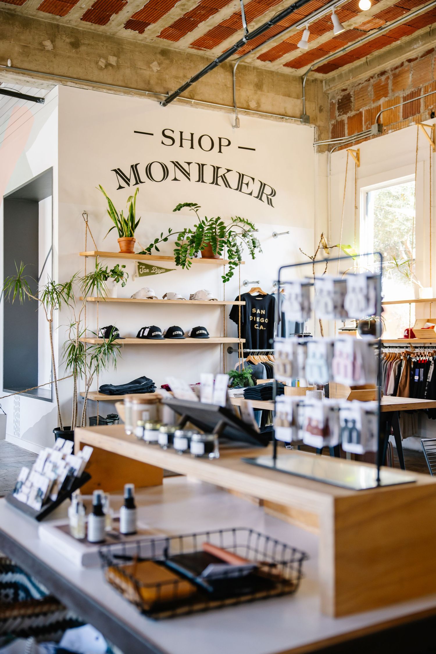 Industrial chic retail space with exposed brick walls and wooden display counters.