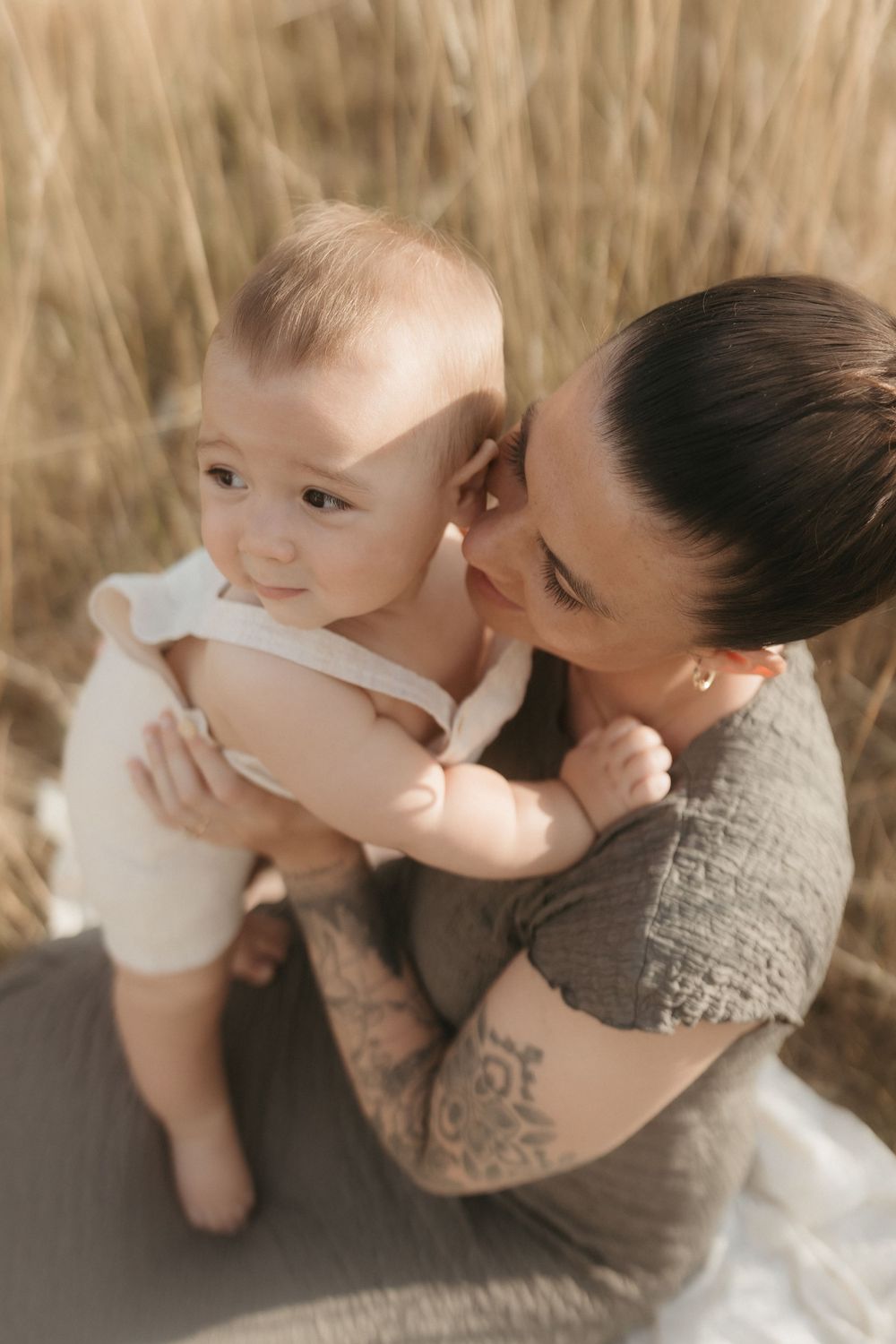 A tender moment captured between parent and baby captured by Northamptonshire Family Photographer Ellen Sear