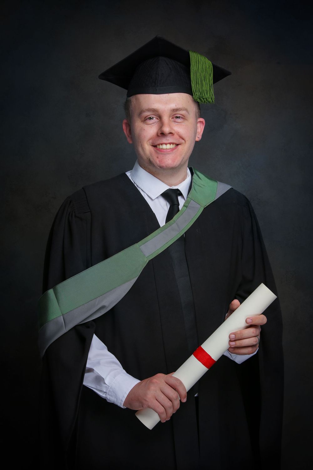 A series of professional graduation portraits showing a graduate in black cap and gown holding a diploma roll against a dark background.