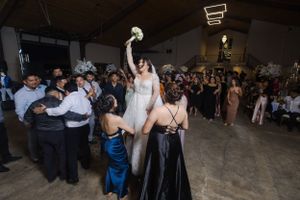 Celebration in a spacious venue with guests dancing and enjoying the festivities.