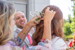 Mom puts flowers in Brides hair at Rexburg temple.