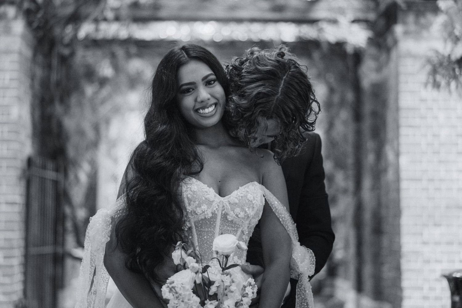 Black and white wedding portraits captured in an outdoor setting.