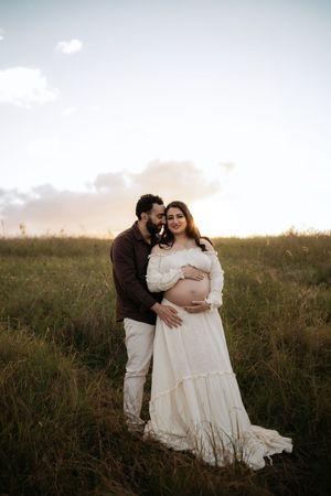 Photo of couple at sunset in Western Sydney. Penrith location at sunset, photographer also offers newborn photography