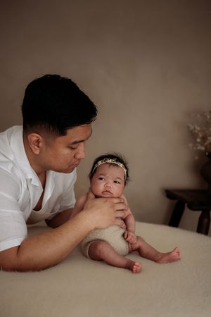 Newborn and father taken in Penrith newborn studio
