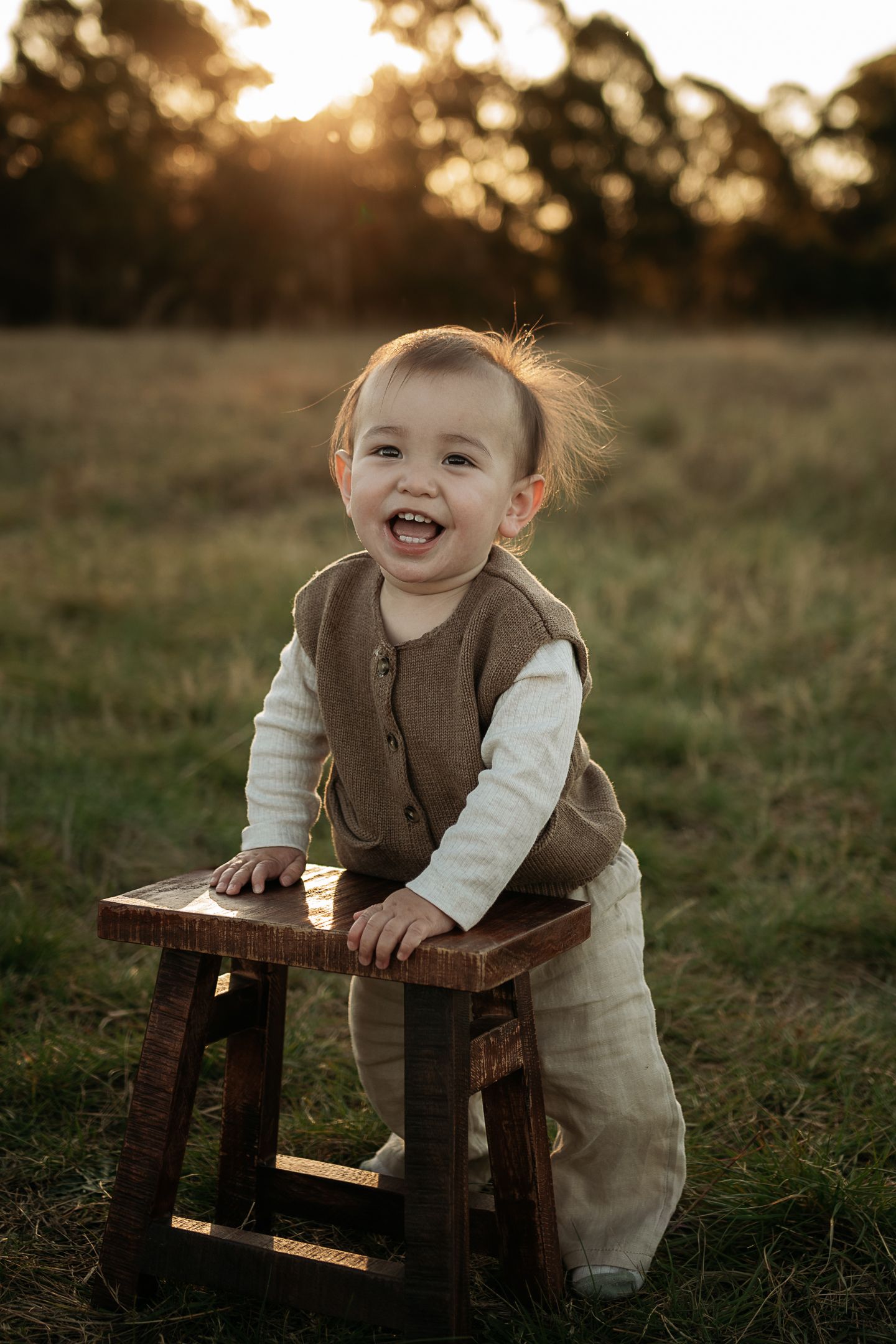 Toddler at sunset in a Western Sydney location with golden light, smiling