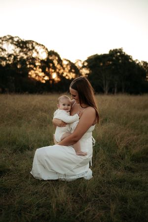 Baby and mother at sunlight in the golden sun in a Western Sydney location