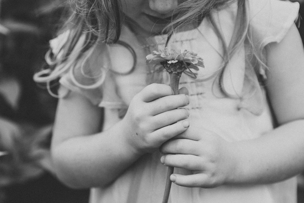 Close-up shots of a young child enjoying a melting ice cream cone with pure delight.