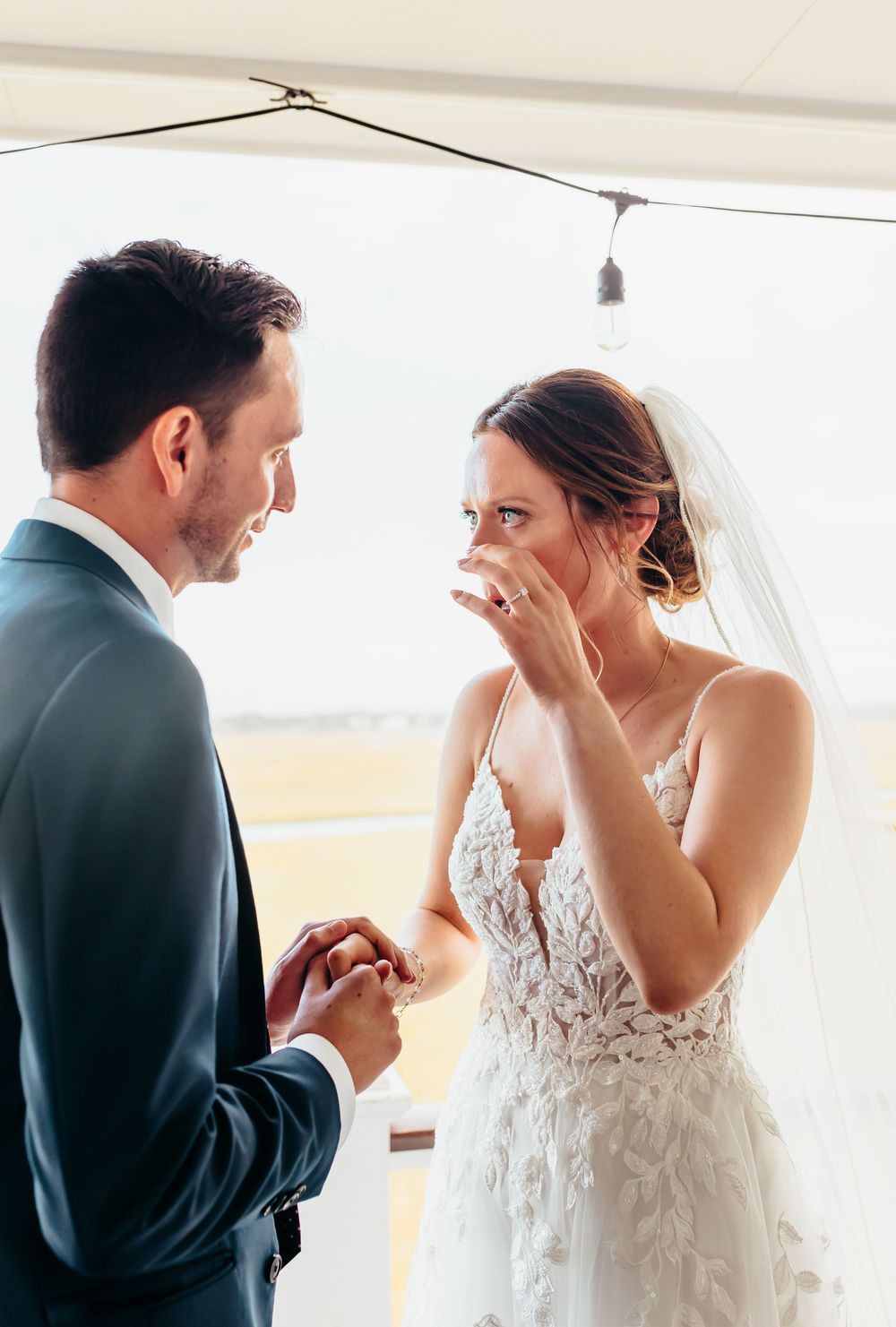 An emotional moment shared between a couple during their wedding day.