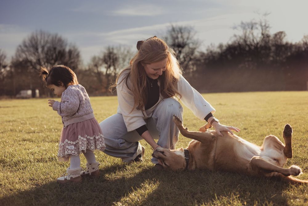 family with dog outside